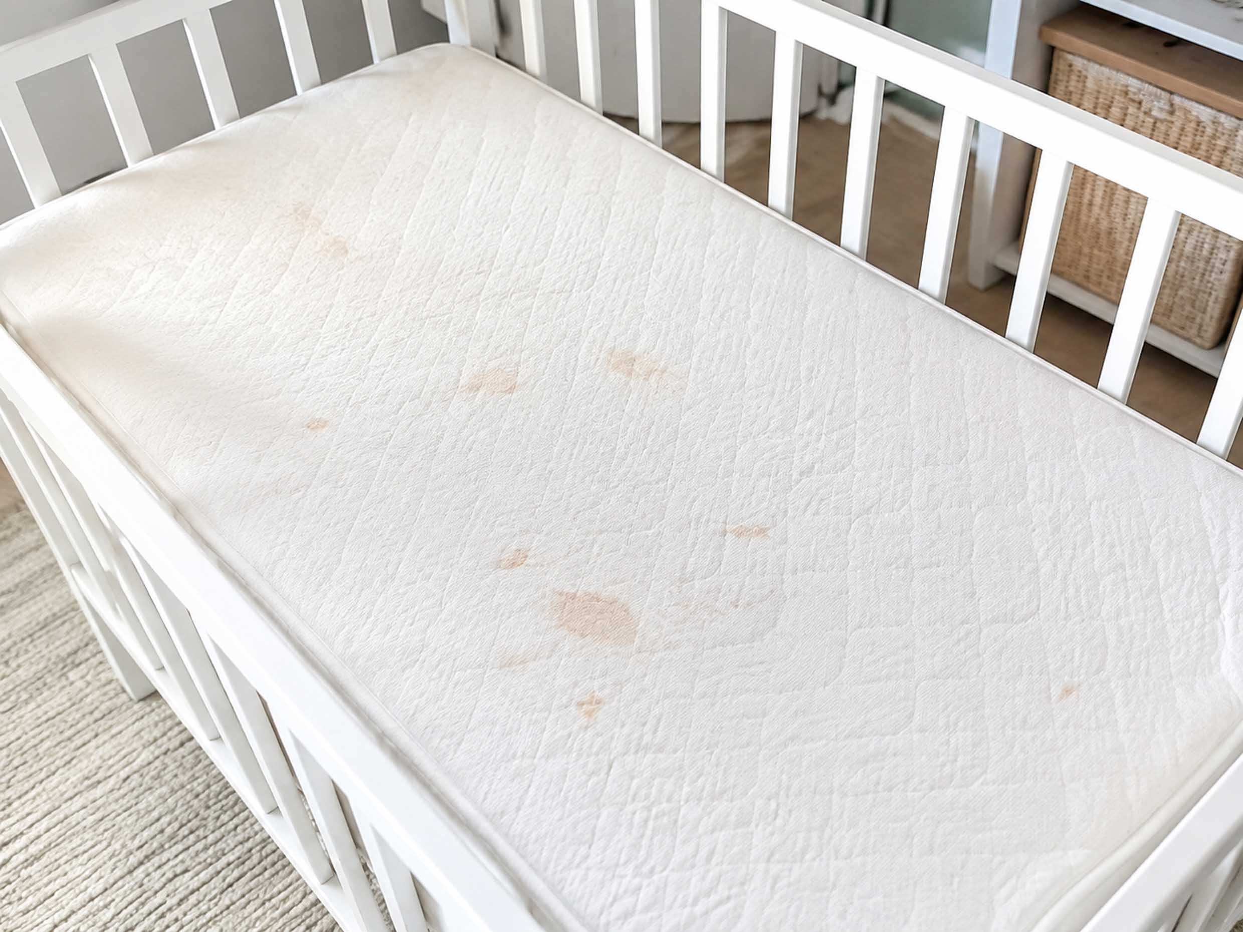 Stained cot mattress before steam cleaning