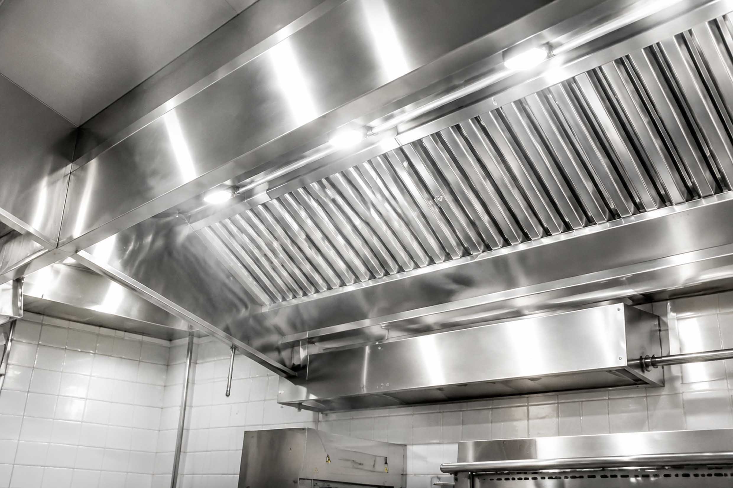 Greasy restaurant kitchen extraction hood before cleaning
