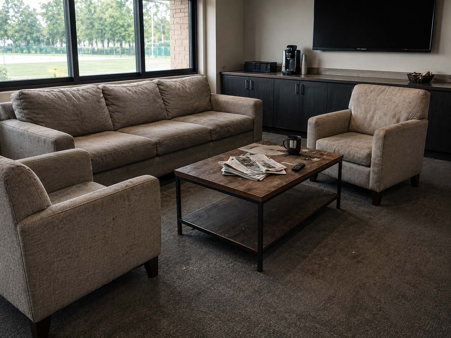 Dirty clubhouse lounge before steam cleaning
